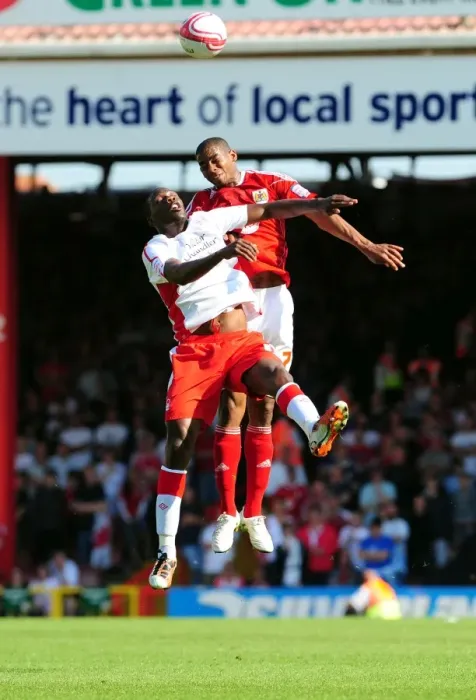 Framed Print : Battling for Supremacy: Marvin Elliott vs Guy Moussi in the Championship Clash between Bristol City and Nottingham Forest (25 / 04 / 2011) Framed Print : Battling for Supremacy: Marvin Elliott vs Guy Moussi in the Championship Clash between Bristol City and Nottingham Forest (25 / 04 / 2011)