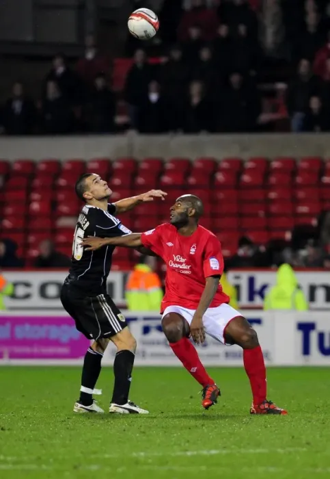 Framed Print : Battling for Supremacy: Adebola vs. Caulker in Forest vs. Bristol City Championship Clash Framed Print : Battling for Supremacy: Adebola vs. Caulker in Forest vs. Bristol City Championship Clash