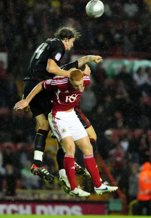 Framed Print : Battling for Supremacy: Aden Flint vs. Ryan Taylor in the 2011 League Cup Clash between Bristol City and Swindon Town Framed Print : Battling for Supremacy: Aden Flint vs. Ryan Taylor in the 2011 League Cup Clash between Bristol City and Swindon Town