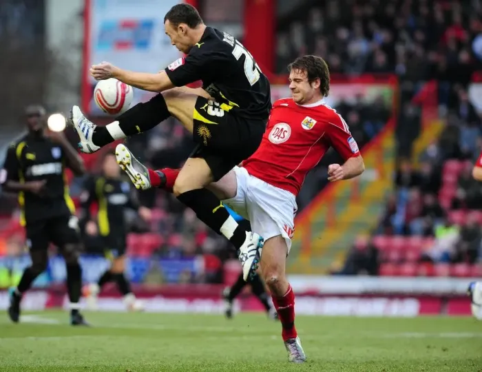 Framed Print : Battling for Supremacy: Brett Pitman vs. Darcy Blake - Bristol City vs. Cardiff City, Championship Clash at Ashton Gate Stadium (January 1, 2011)