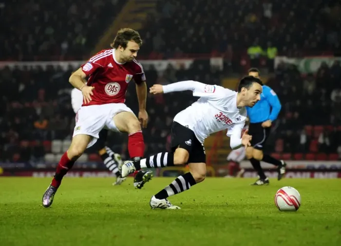 Framed Print : Battling for Supremacy: Brett Pitman vs. Leon Britton in the 2011 Championship Clash between Bristol City and Swansea City Framed Print : Battling for Supremacy: Brett Pitman vs. Leon Britton in the 2011 Championship Clash between Bristol City and Swansea City