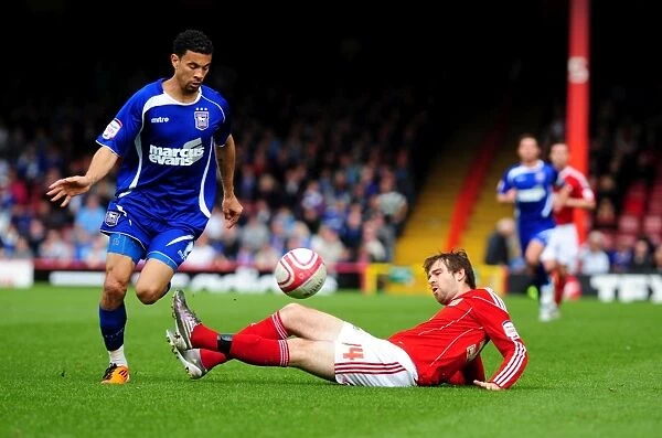 Battling for Supremacy: Brett Pitman vs. Carlos Edwards in the Championship Clash between Bristol City and Ipswich Town (16 / 04 / 2011)