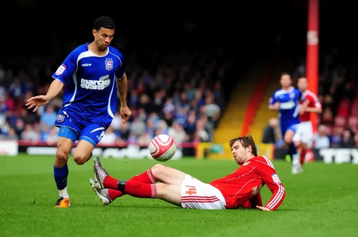 Framed Print : Battling for Supremacy: Brett Pitman vs. Carlos Edwards in the Championship Clash between Bristol City and Ipswich Town (16 / 04 / 2011)