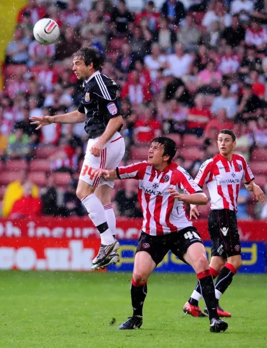 Framed Print : Battling for Supremacy: Brett Pitman vs. Harry Maguire in the 2011 Championship Clash between Sheffield United and Bristol City
