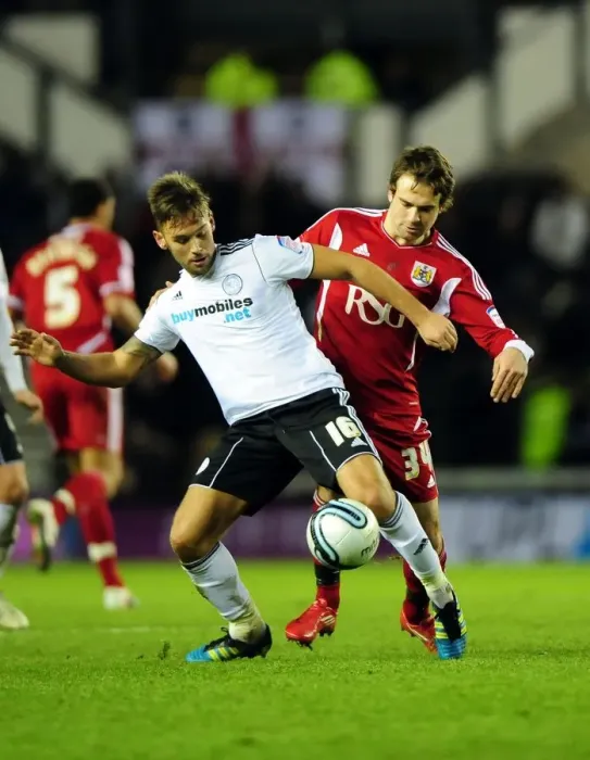 Framed Print : Battling for Supremacy: Brett Pitman vs. James Bailey in Derby County vs. Bristol City Championship Clash - 10 / 12 / 2011 Framed Print : Battling for Supremacy: Brett Pitman vs. James Bailey in Derby County vs. Bristol City Championship Clash - 10 / 12 / 2011