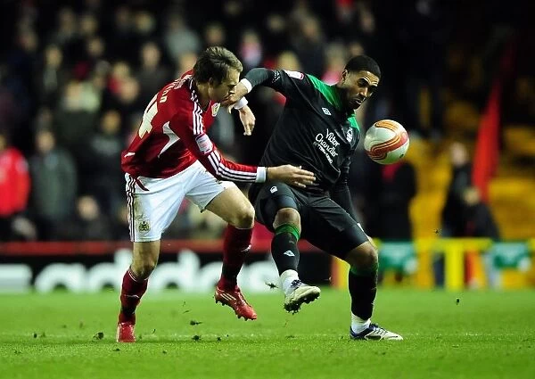 Battling for Supremacy: Brett Pitman vs. Lewis McGugan in the 2011 Championship Clash between Bristol City and Nottingham Forest