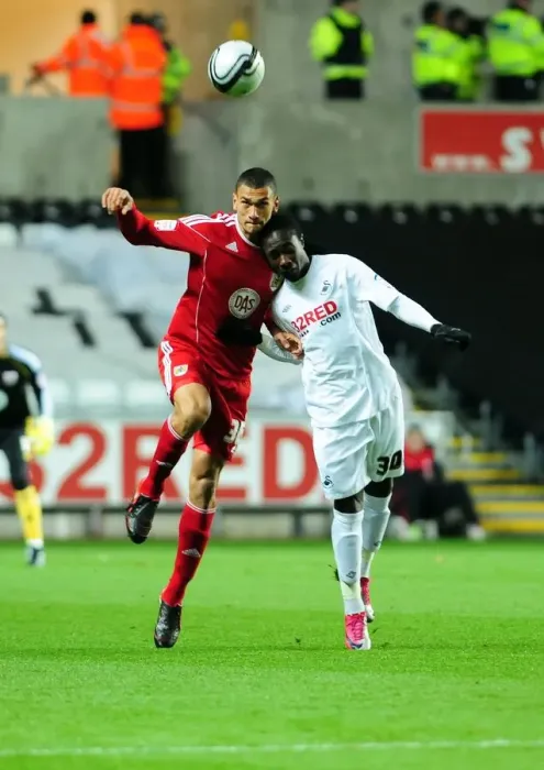 Framed Print : Battling for Supremacy: Caulker vs. Emnes in the Championship Clash between Swansea City and Bristol City (10 / 11 / 2010) Framed Print : Battling for Supremacy: Caulker vs. Emnes in the Championship Clash between Swansea City and Bristol City (10 / 11 / 2010)