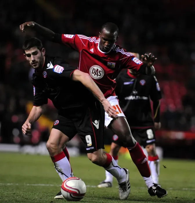 Framed Print : Battling for Supremacy: Cisse vs. Evans in the Championship Clash between Bristol City and Sheffield United (November 2010) Framed Print : Battling for Supremacy: Cisse vs. Evans in the Championship Clash between Bristol City and Sheffield United (November 2010)