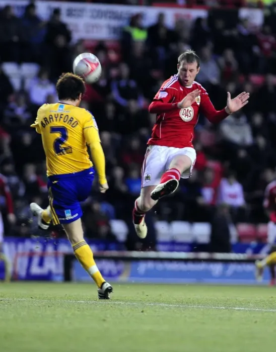Framed Print : Battling for Supremacy: Clarkson vs. Brayford in the Championship Clash between Bristol City and Derby County