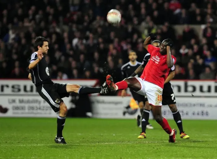 Framed Print : Battling for Supremacy: Cole Skuse vs. Guy Moussi in Nottingham Forest vs. Bristol City Football Match, 2011