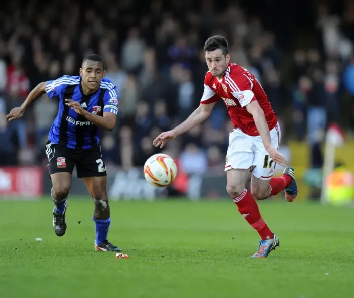 Framed Print : Battling for Supremacy: Cunningham vs Thompson in the Sky Bet League One Clash at Ashton Gate