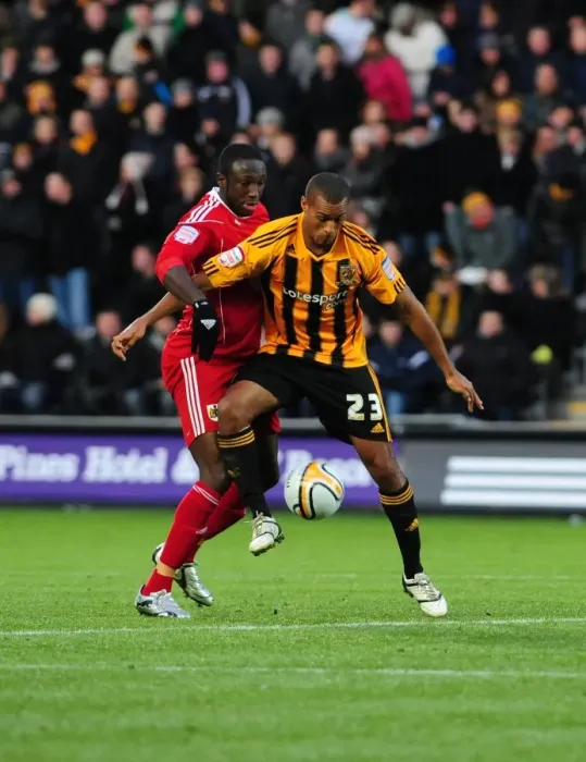 Framed Print : Battling for Supremacy: Damion Stewart vs. Jay Simpson in the 2010 Championship Clash between Hull City and Bristol City Framed Print : Battling for Supremacy: Damion Stewart vs. Jay Simpson in the 2010 Championship Clash between Hull City and Bristol City