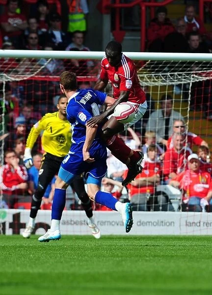 Battling for Supremacy: Damion Stewart vs. Connor Wickham in the Championship Clash between Bristol City and Ipswich Town (16-04-2011)
