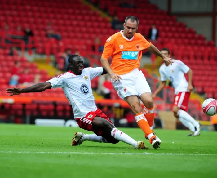 Framed Print : Battling for Supremacy: Damion Stewart vs Blackpool, Bristol City Championship Clash (31 / 07 / 2010) Framed Print : Battling for Supremacy: Damion Stewart vs Blackpool, Bristol City Championship Clash (31 / 07 / 2010)