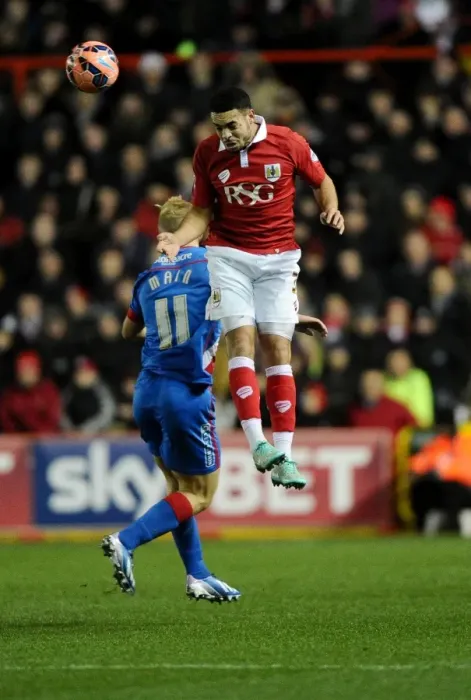 Framed Print : Battling for Supremacy: Derrick Williams vs. Curtis Main at Ashton Gate Stadium