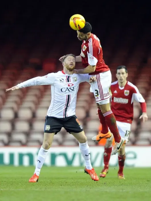 Framed Print : Battling for Supremacy: Derrick Williams vs. Dean Bowditch in Bristol City vs. MK Dons Football Match Framed Print : Battling for Supremacy: Derrick Williams vs. Dean Bowditch in Bristol City vs. MK Dons Football Match
