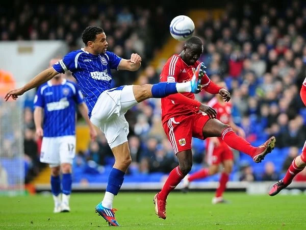 Battling for Supremacy: Edwards vs. Adomah in Ipswich Town vs. Bristol City Football Match, March 2012
