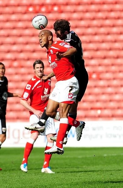 Battling for Supremacy: Haynes vs. McAllister in the Championship Clash between Barnsley and Bristol City (09 / 04 / 2011)