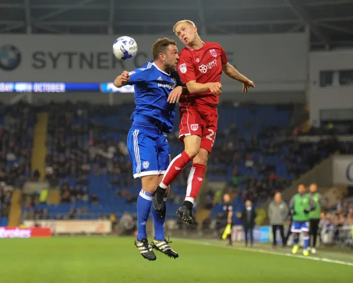 Framed Print : Battling for Supremacy: Hordur Magnusson vs. Rickie Lambert in Cardiff City vs. Bristol City Championship Clash