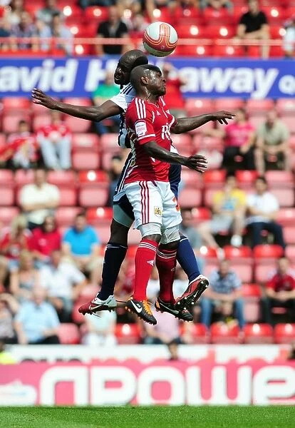 Battling for Supremacy: Jamal Campbell-Ryce vs. Youssouf Mulumbu in the Championship Clash between Bristol City and West Brom (30 / 07 / 2011)