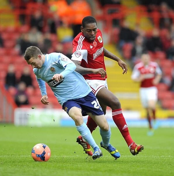 Battling for Supremacy: Jay Emmanuel-Thomas vs Jack Connors in the FA Cup Clash between Bristol City and Dagenham and Redbridge