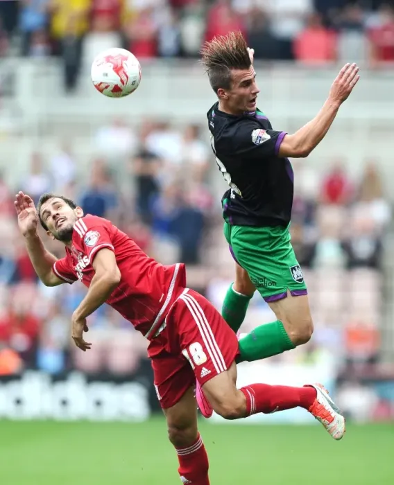 Framed Print : Battling for Supremacy: Joe Bryan vs. Christian Stuani in Middlesbrough vs. Bristol City Championship Clash Framed Print : Battling for Supremacy: Joe Bryan vs. Christian Stuani in Middlesbrough vs. Bristol City Championship Clash