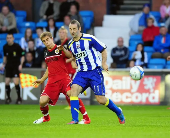 Framed Print : Battling for Supremacy: Joe Bryan vs. Gary Harkins in Kilmarnock vs. Bristol City Pre-Season Clash Framed Print : Battling for Supremacy: Joe Bryan vs. Gary Harkins in Kilmarnock vs. Bristol City Pre-Season Clash