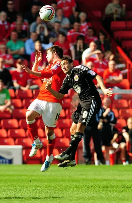 Framed Print : Battling for Supremacy: Johnson vs. Butterfield in the Championship Clash between Barnsley and Bristol City (09 / 04 / 2011) Framed Print : Battling for Supremacy: Johnson vs. Butterfield in the Championship Clash between Barnsley and Bristol City (09 / 04 / 2011)