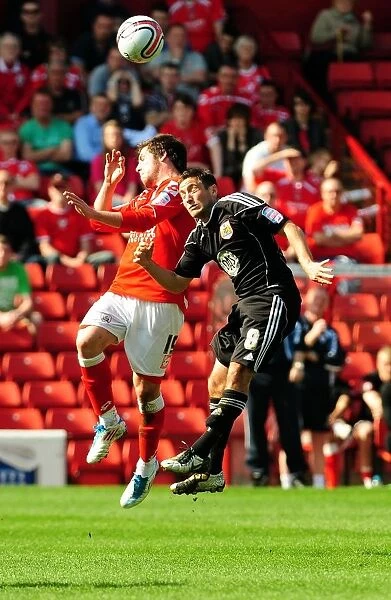 Battling for Supremacy: Johnson vs. Butterfield in the Championship Clash between Barnsley and Bristol City (09 / 04 / 2011)