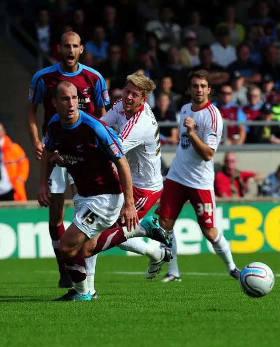 Framed Print : Battling for Supremacy: Jon Stead vs. David Mirfin in the Championship Clash between Scunthorpe United and Bristol City (September 11, 2010)