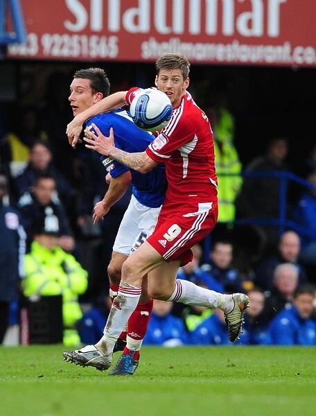 Battling for Supremacy: Jon Stead vs. Jason Pearce in Portsmouth vs. Bristol City Football Match, 2012