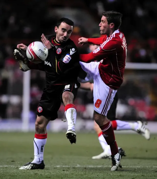 Framed Print : Battling for Supremacy: Lee Johnson vs. Leon Britton in the Championship Clash between Bristol City and Sheffield United (November 2010) Framed Print : Battling for Supremacy: Lee Johnson vs. Leon Britton in the Championship Clash between Bristol City and Sheffield United (November 2010)