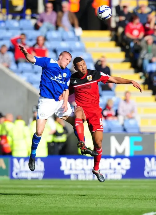 Framed Print : Battling for Supremacy: Lewin Nyatanga vs. Jamie Vardy in Leicester City vs. Bristol City Championship Clash Framed Print : Battling for Supremacy: Lewin Nyatanga vs. Jamie Vardy in Leicester City vs. Bristol City Championship Clash
