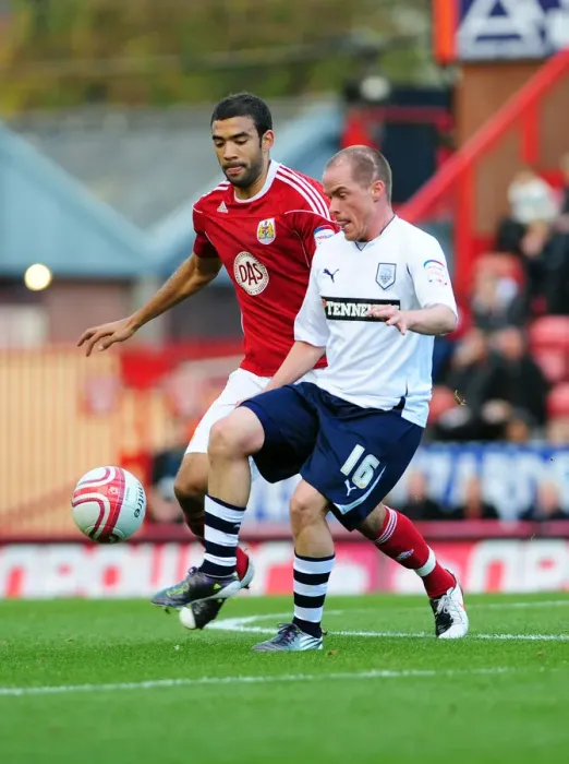 Framed Print : Battling for Supremacy: Liam Fontaine vs. Iain Hume in the Championship Clash between Bristol City and Preston North End