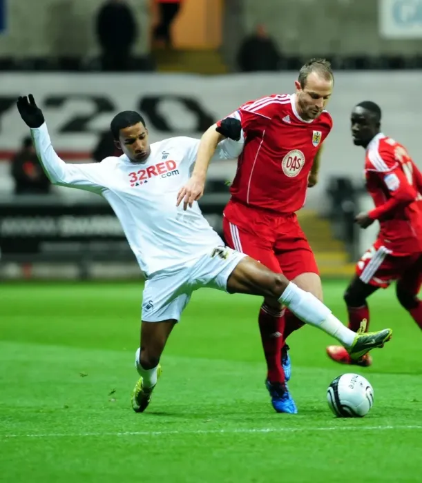 Framed Print : Battling for Supremacy: Louis Carey vs. Scott Sinclair in Swansea City vs. Bristol City Championship Clash (10 / 11 / 2010) Framed Print : Battling for Supremacy: Louis Carey vs. Scott Sinclair in Swansea City vs. Bristol City Championship Clash (10 / 11 / 2010)
