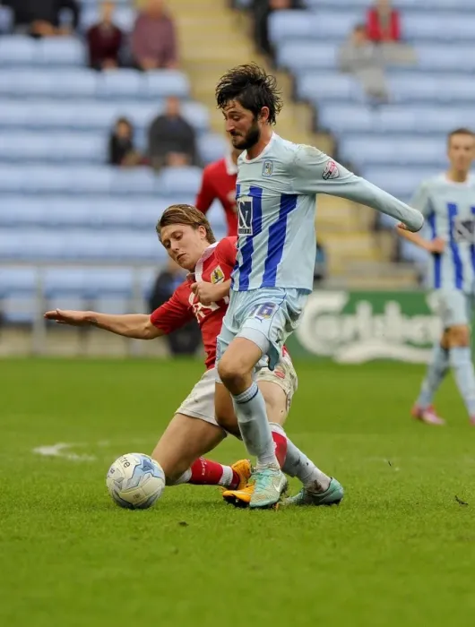 Framed Print : Battling for Supremacy: Luke Freeman vs. Adam Barton in Bristol City's Sky Bet League One Clash at Coventry City's Ricoh Arena
