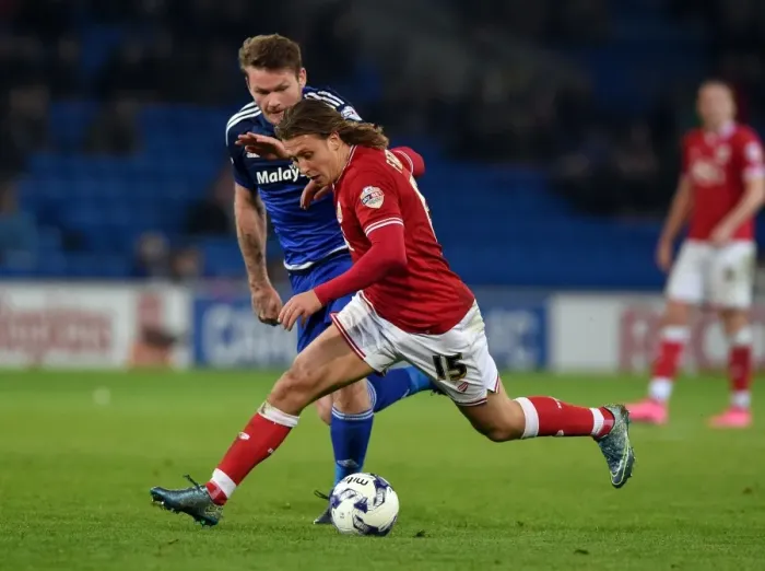Framed Print : Battling for Supremacy: Luke Freeman vs. Aron Gunnarsson in Cardiff City vs. Bristol City Championship Clash