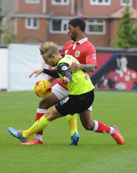 Framed Print : Battling for Supremacy: Mark Little vs. Joseph Mills in Bristol City's Clash with Oldham Athletic Framed Print : Battling for Supremacy: Mark Little vs. Joseph Mills in Bristol City's Clash with Oldham Athletic