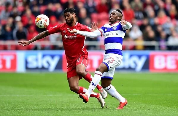 Battling for Supremacy: Mark Little vs. Yeni Ngbakoto in the Sky Bet Championship Clash between Bristol City and Queens Park Rangers