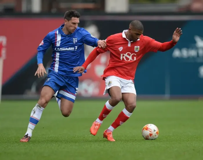 Framed Print : Battling for Supremacy: Mark Little vs Joe Martin in Bristol City vs Gillingham Clash Framed Print : Battling for Supremacy: Mark Little vs Joe Martin in Bristol City vs Gillingham Clash