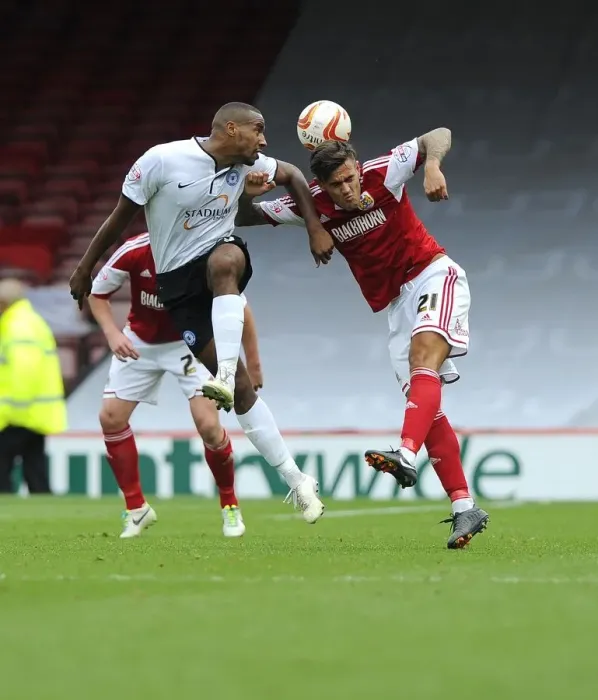 Framed Print : Battling for Supremacy: Marlon Pack vs. Tyrone Barnett in the Sky Bet League One Clash between Bristol City and Peterborough United