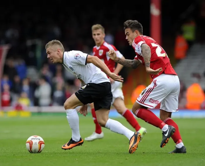 Framed Print : Battling for Supremacy: Marlon Pack vs Jack Payne in Bristol City vs Peterborough United Clash