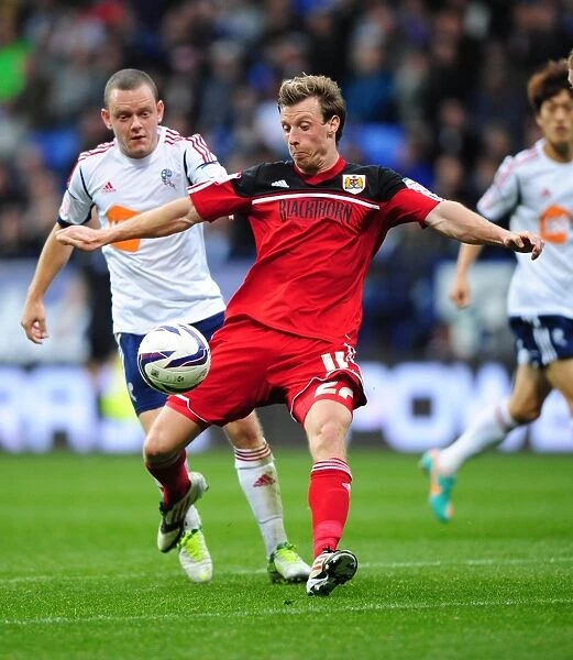 Battling for Supremacy: Martyn Woolford vs. Jay Spearing in the 2012 Championship Clash between Bolton Wanderers and Bristol City