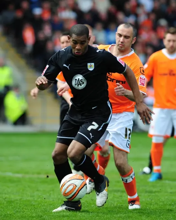 Framed Print : Battling for Supremacy: Marvin Elliott vs. Gary Taylor-Fletcher in the 2010 Championship Clash between Blackpool and Bristol City