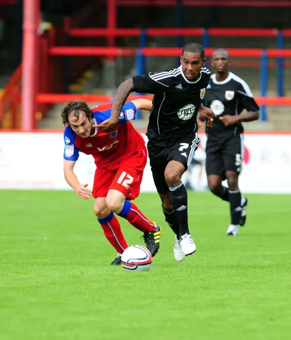 Framed Print : Battling for Supremacy: Marvin Elliott vs. Danny Hylton in Intense Football Clash