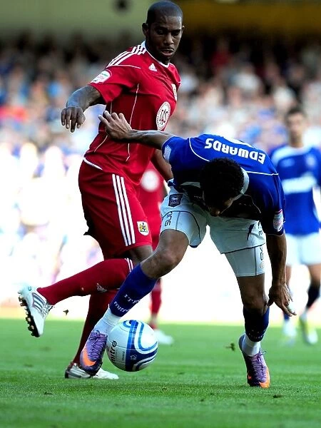Battling for Supremacy: Marvin Elliott vs. Carlos Edwards in the Championship Clash between Ipswich and Bristol City (August 2010)
