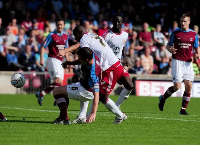 Framed Print : Battling for Supremacy: Marvin Elliott vs. Cliff Byrne in the Championship Clash between Scunthorpe United and Bristol City (September 11, 2010)