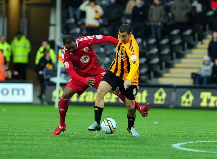 Framed Print : Battling for Supremacy: Marvin Elliott vs. James Harper in Hull City vs. Bristol City Championship Clash (18 / 12 / 2010)