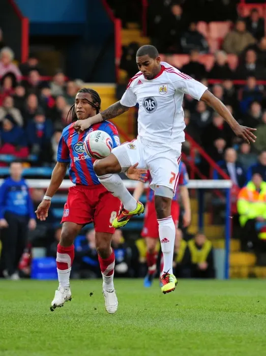 Framed Print : Battling for Supremacy: Marvin Elliott vs. Neil Danns in the 2011 Championship Clash between Crystal Palace and Bristol City