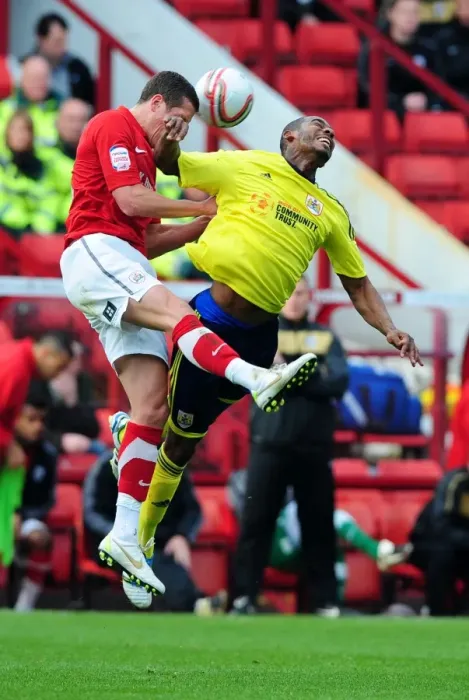 Framed Print : Battling for Supremacy: Marvin Elliott vs. Nathan Doyle in Championship Clash between Barnsley and Bristol City Framed Print : Battling for Supremacy: Marvin Elliott vs. Nathan Doyle in Championship Clash between Barnsley and Bristol City